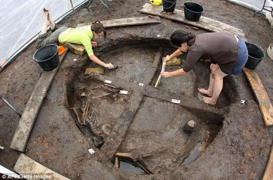 1408112513439 wps 3 researchers exhume human