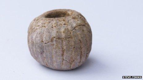 70441825-potgate-carvedstonebead.jpg